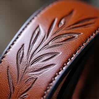 Leather belt with floral embossing
